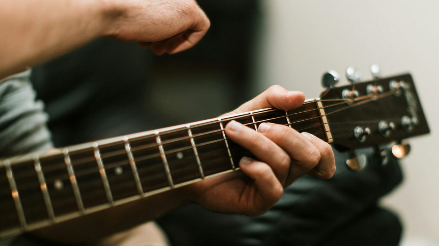 Person playing guitar